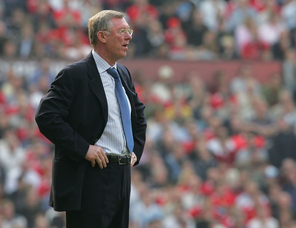Coaches and analysts discussing a controversial referee decision during a football match