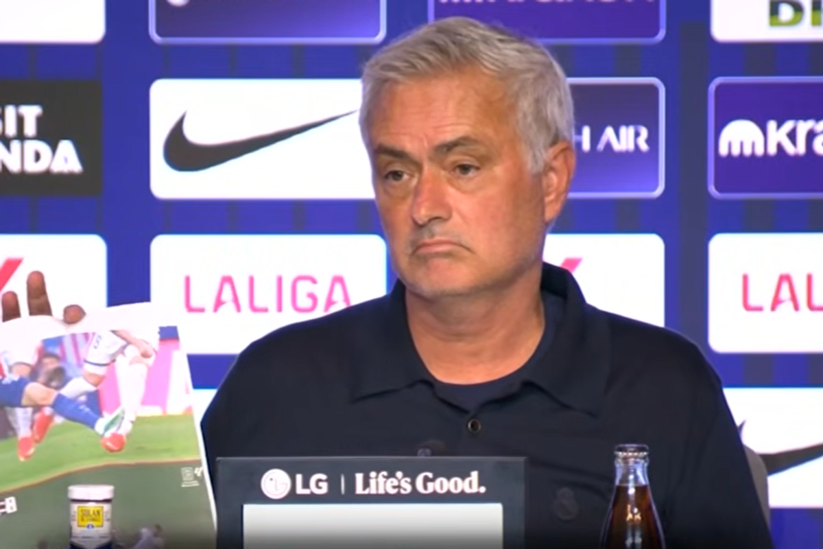 Jose Mourinho showing images in the post-match press conference addressing referee decisions